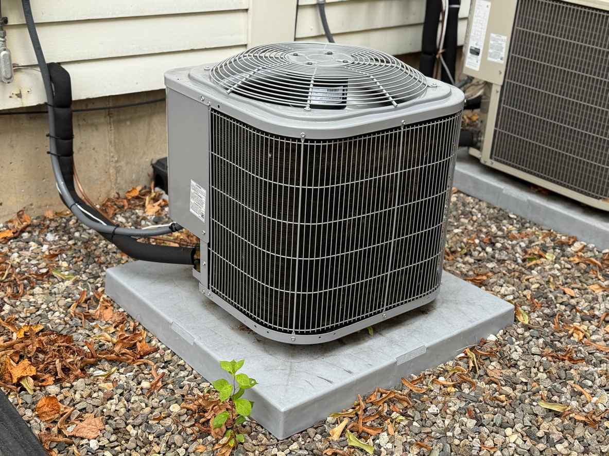 Modern HVAC air conditioner outside of residential home