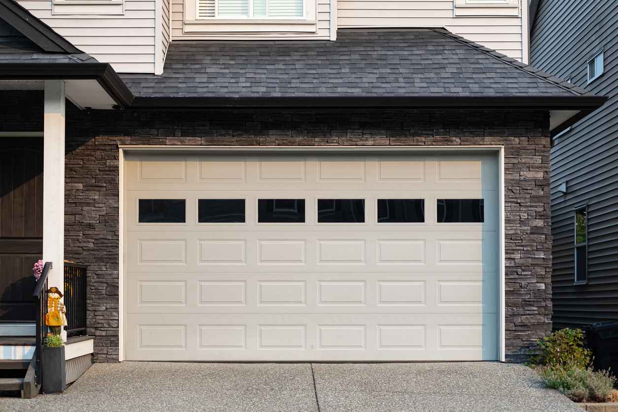 Modern house with garage door that is closed.