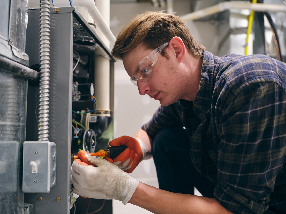 Tech Working On Furnace