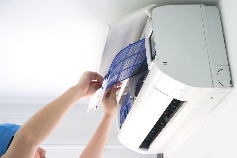 HVAC technician working on a ductless mini split system