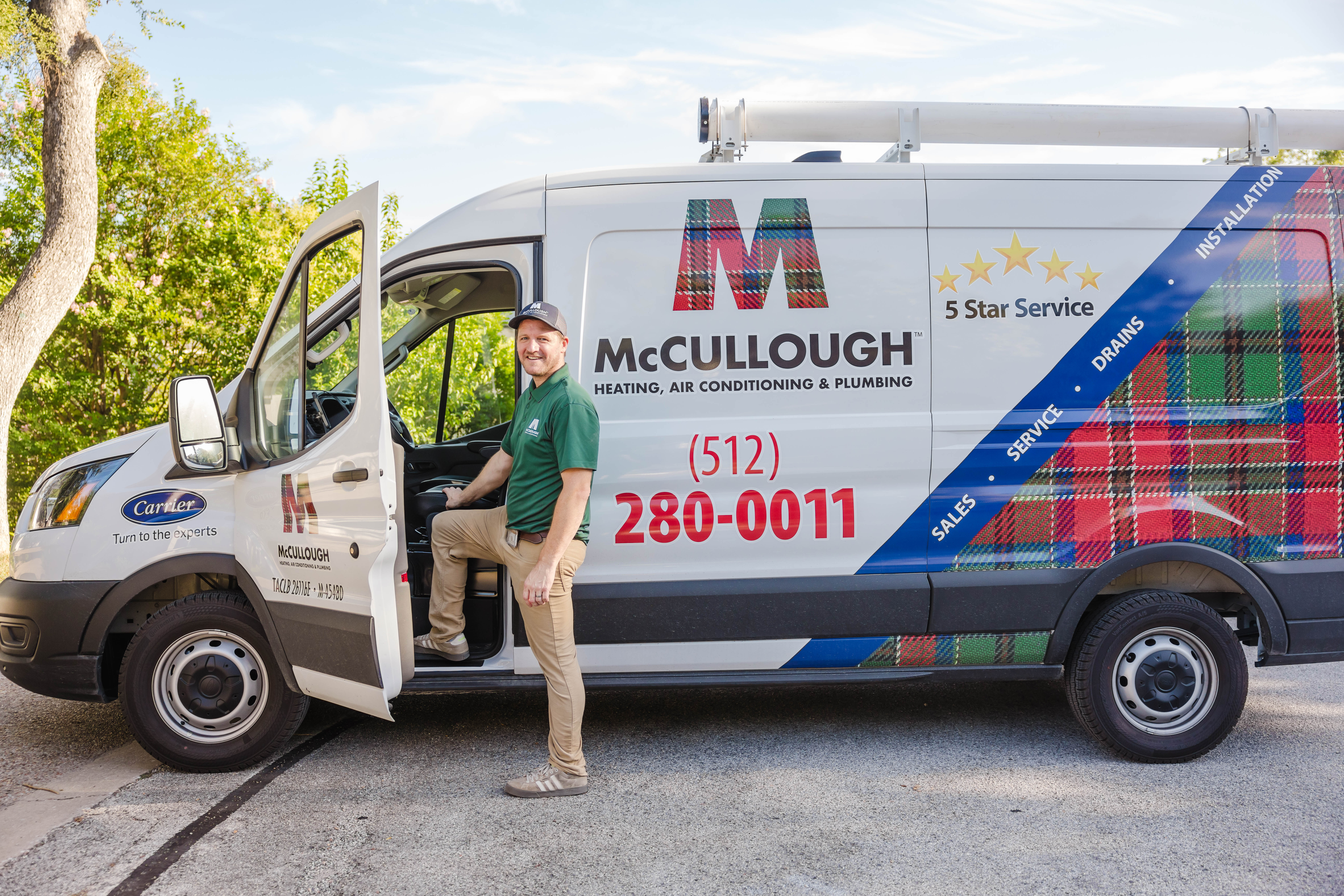 Technician in green polo stepping out of a McCullough service van labeled Heating, Air Conditioning & Plumbing with '5 Star Service' graphics and phone number visible on the side panel